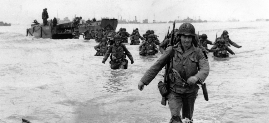 U.S. infantrymen wade through the surf as they land at Normandy, France on June 6, 1944.