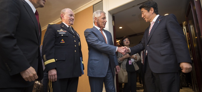 Defense Secretary Chuck Hagel and Joint Chiefs Chairman Gen. Martin Dempsey meet with Japanese Prime Minister Shinzo Abe at the Shangri La Hotel in Singapore, on May 30, 2014.