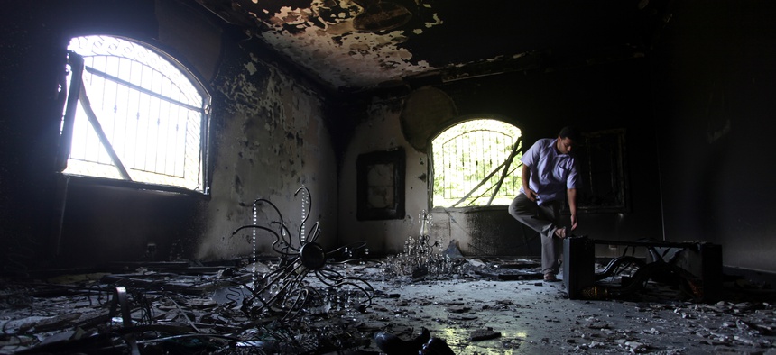 A Libyan man investigates the inside of the U.S. Consulate in Benghazi, Libya, on September 13, 2012.