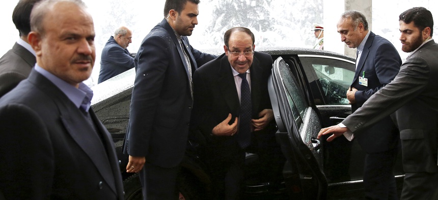 Iraqi PM Nouri al-Maliki arrives in Tehran for a meeting with former Iranian president Rafsanjani, on December 5, 2013.