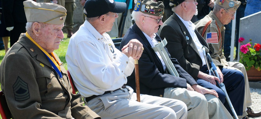 Military retirees listen to a presentation at Fort Bliss, Texas, on June 2, 2012.
