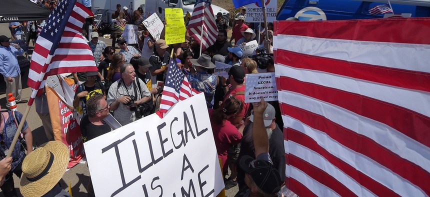 Protesters clash on July 4th, 2014, as the immigration debate heats up, at U.S. Border Patrol station in Murrieta, Calif.