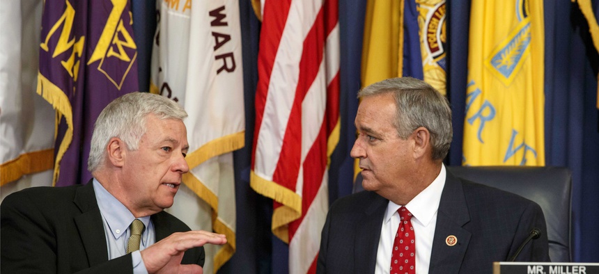 Rep. Jeff Miller, R-Fla., speaks to Rep. Mike Michaud, D-Maine, as the panel holds a hearing on the crisis at VA facilities, on June 9, 2014.