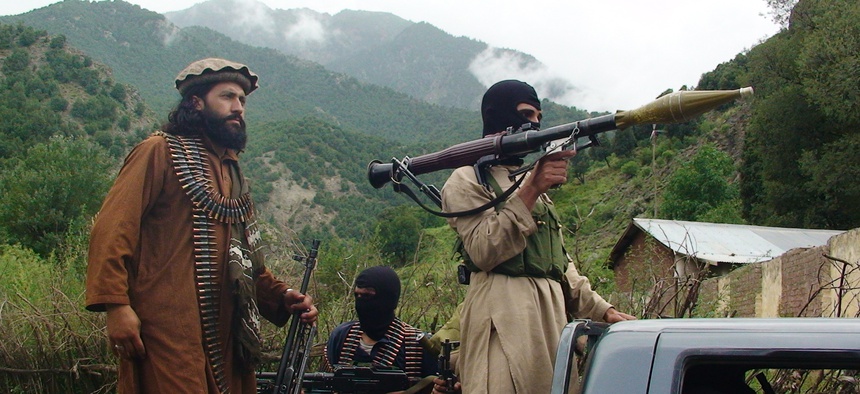 Pakistani Taliban patrol in the tribal region of South Waziristan on August 5, 2012.