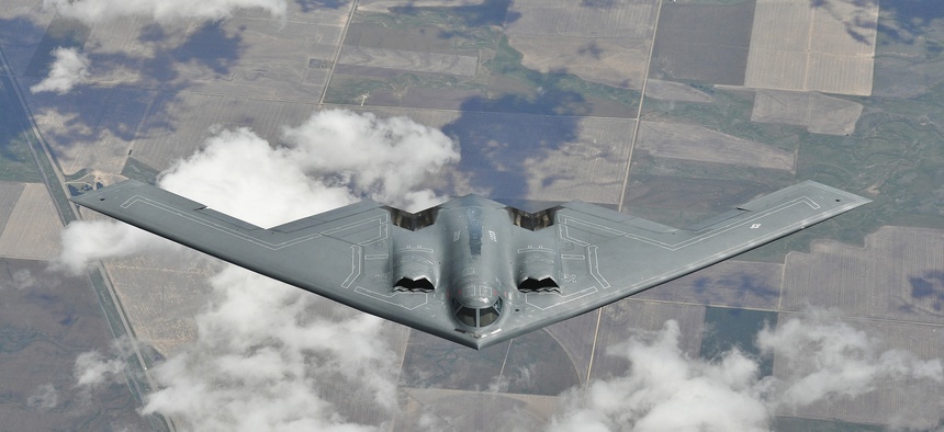An Air Force B-2 bomber descends after succesfully refueling with a KC-135 tanker, on May 9, 2012.