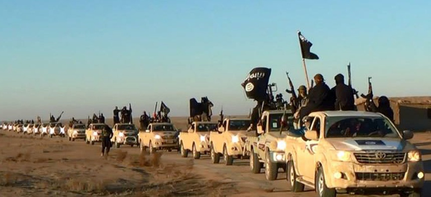 ISIL militants in a convoy drive into Iraq's Anbar Province, on January 10, 2014.