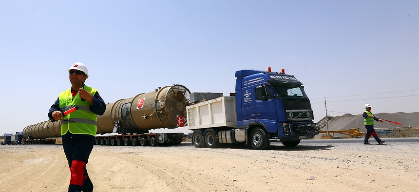 New oil refinery equipment arrives at Kalak refinery on the outskirts of Irbil, Iraq, on July 14, 2014.