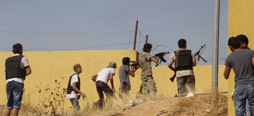 An Islamist Misarata brigade fires at a rival militia towards Tripoli Airport, on July 26, 2014.