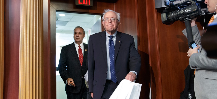 Senate Veterans’ Affairs Committee Chairman Sen. Bernie Sanders, I-Vt., and House Veterans’ Affairs Committee Chairman Rep. Jeff Miller, R-Fla., arrive for news conference on a breakthrough VA reform bill at Capitol Hill, in Washington, July 28, 2014.