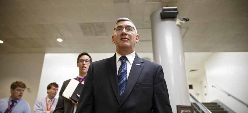 Sen. John Walsh, D-Mont., leaves the Capitol after filing votes on June 3, 2014.