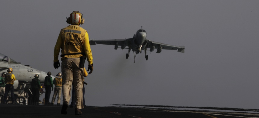 An EA-6B coming from a mission in Iraq lands on the deck of the USS George H.W. Bush on August, 10, 2014.