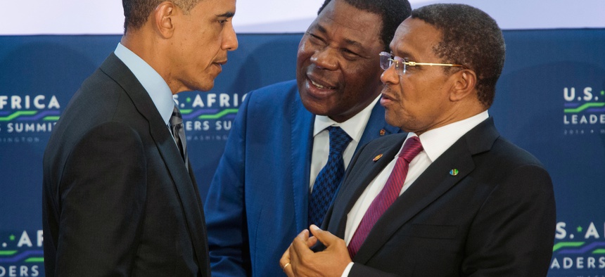 President Barack Obama, left, talks with Benin President Yayi Boni, center, and Tanzania President Jakaya Kikwete, right, at the start of the 3rd Session at the US African Leaders Summit, Wednesday, Aug. 6, 2014, at the State Department in Washington.