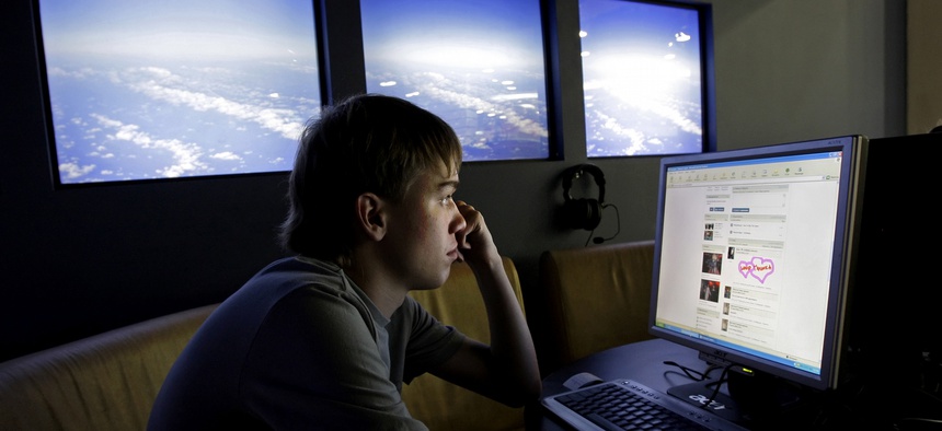 A Russian teenager visits Vkontakte, a Russian social networking site at an internet cafe in Moscow.