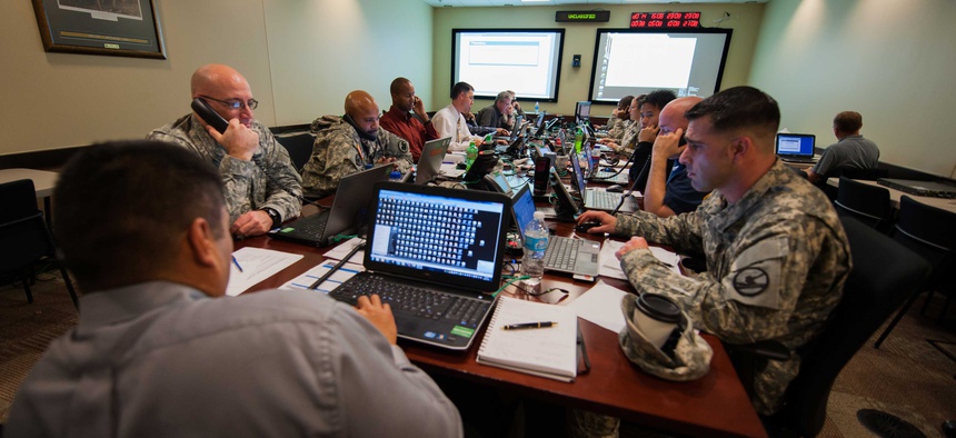Computer tech support experts with the Army Reserve answer calls during an Enterprise Email Migration at U.S. Army Forces Command.