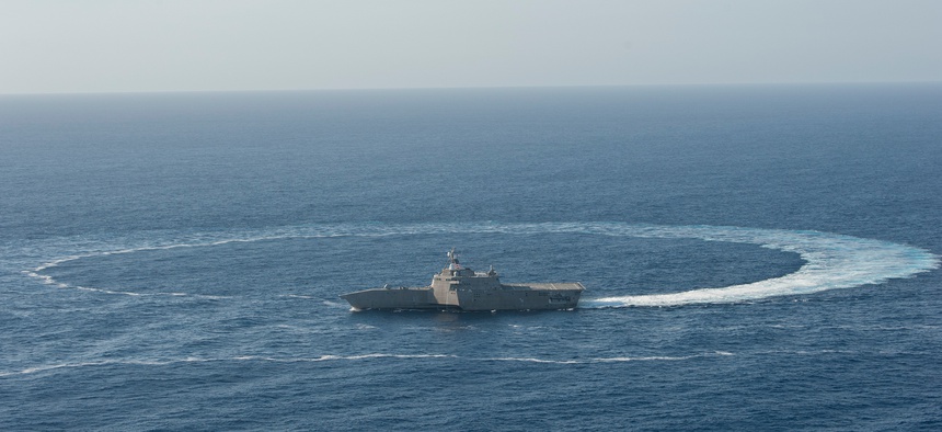 The littoral combat ship USS Independence (LCS 2) shows its maneuverability while underway in the Pacific Ocean, April 23, 2014.