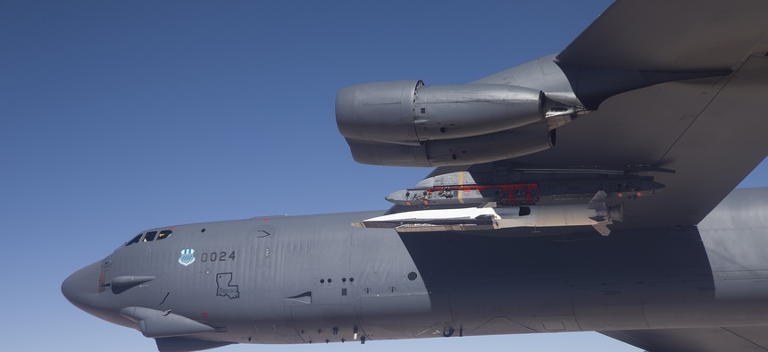 An X-51A Waverider test vehicle is attached to a B-52H Stratofortress prior to a test over the Pacific Ocean.