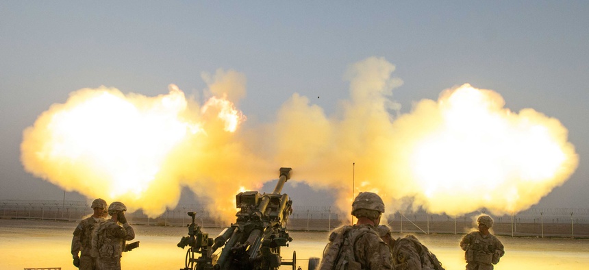 Soldiers with the 4th Infantry Brigade Combat Team shoot a round downrange from a howitzer on Kandahar Airfield, Afghanistan.