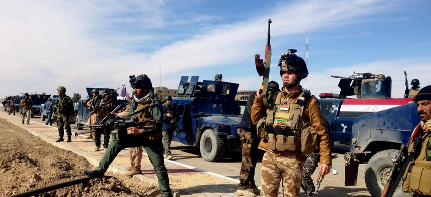 Iraqi Security Forces, on February 2, 2014, prepare to attack Islamic State militants in the western city of Ramadi.