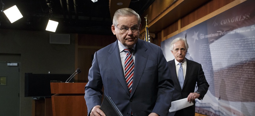 Senate Foreign Relations Committee Chairman Sen. Robert Menendez, D-N.J., and Sen. Bob Corker, R-Tenn., finish a news conference on Capitol Hill on March 27, 2014.