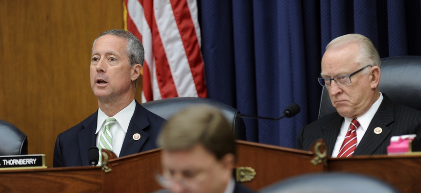 Reps. Mac Thornberry, R-Texas., and Buck McKeon, R-Calif., listen during a House Armed Services Committee hearing, on June 11, 2014.