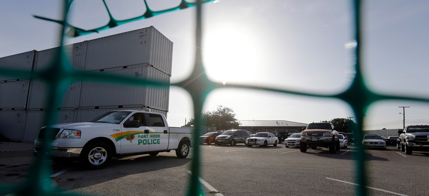 Metal shipping containers form a makeshift barrier around the Lawrence William Judicial Center as the sentencing phase for Maj. Nidal Hasan continues, Aug. 28, 2013, in Fort Hood, Texas.