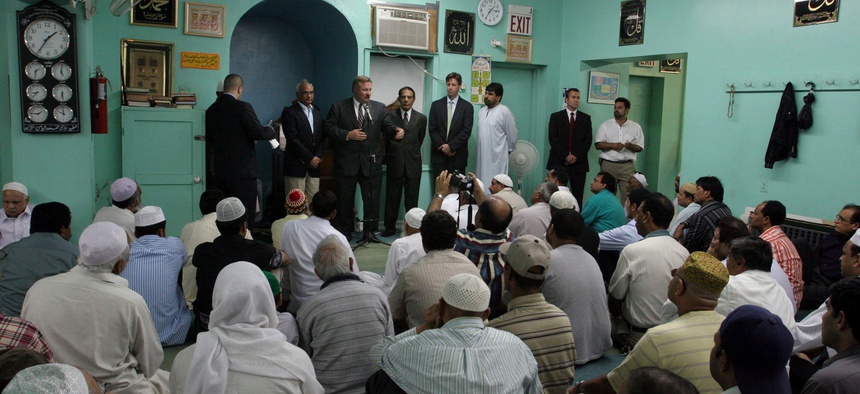 Officials from the FBI's New York counterterrorism division speak at the Makki Mosque in the Brooklyn borough of New York in the wake of the London terror attacks in July 2005.