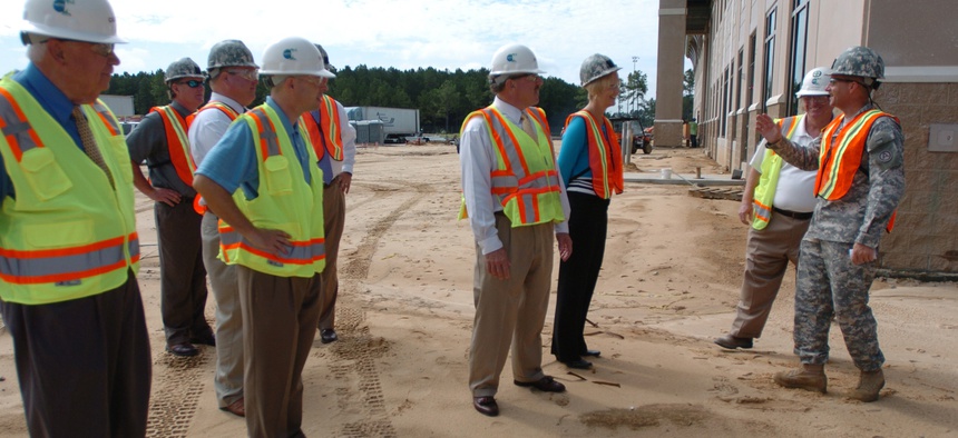 An NCO with the Army Central Advance Party speaks to members of the Sumter Chamber of Commerce during a tour of the construction site of the Third Army's new headquarters at Shaw Air Force Base.