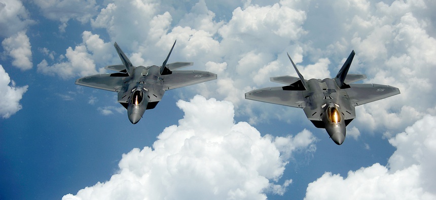 Two of the U.S. Air Force's F-22 Raptors in flight.