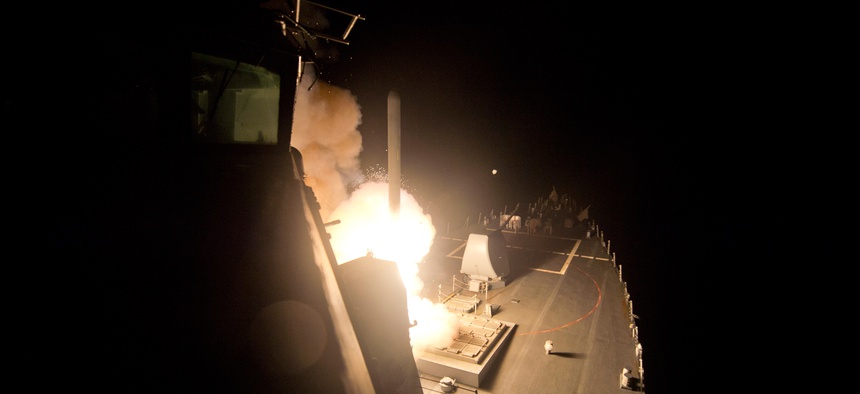 The guided-missile destroyer USS Arleigh Burke (DDG 51) launches Tomahawk cruise missiles to conduct strikes against ISIL targets, Sept. 23, 2014.