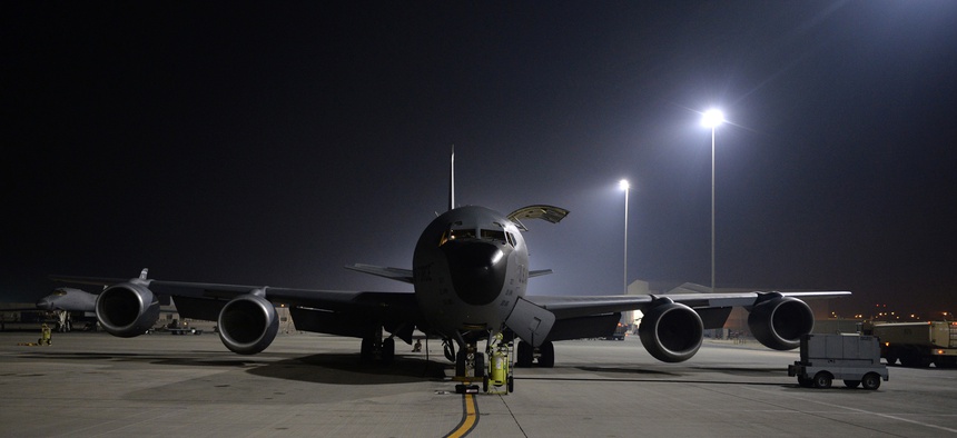 An Air Force KC-135 Stratotanker receives pre-flight checks before taking off from a base in the U.S. Central Command Area of Responsibility in support of a mission to conduct air strikes in Syria, Sept. 23, 2014.