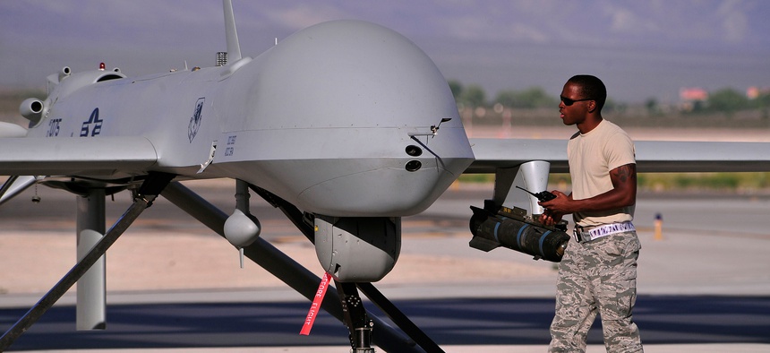 A crew chief prepares an MQ-1B Predator for a training mission.