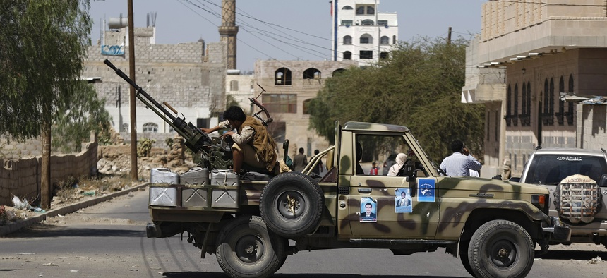 A Houthi Shiite rebel mans a machine gun on a military truck in Sanaa, Yemen, on October 20, 2014.