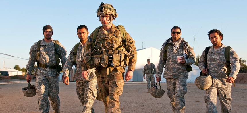 An NCO with the 101st Airborne Division leads a gorup of interpreters during a training exercise at Joint Readiness Training Center in Fort Polk, La.
