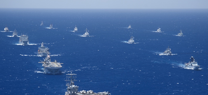 Ships and submarines participating in the 2012 Rim of the Pacific exercise stay in close formation during one part of the exercise.