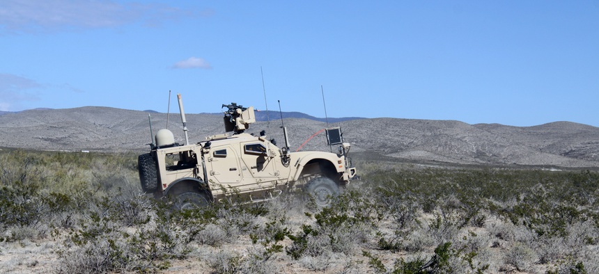 Soldiers from 2nd Brigade, 1st Armored Division drive a vehicle equipped with Warfighter Information Network-Tactical (WIN-T) Increment 2 during the Army’s Network Integration Evaluation (NIE) 13.1 on Nov. 9, 2012.