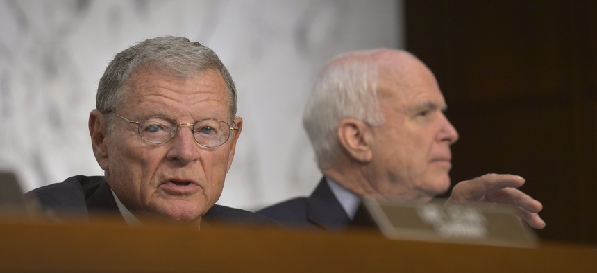 Sen. Jim Inhofe, R-Okla., and Sen. John McCain, R-Ariz., attend a Senate Armed Services Committee hearing on Sept. 16, 2014.