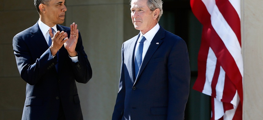 In this April 25, 2013 file photo, President Barack Obama stands with former president George W. Bush at the dedication of the George W. Bush presidential library on the campus of Southern Methodist University in Dallas.