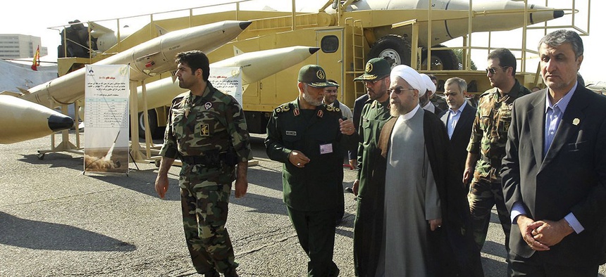 Iran's President Hassan Rouhani visits a defense industry display in Tehran, Iran, on August 24, 2014.