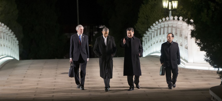 President Obama walks with China's President Xi Jinping at the Zhongnanhai leaders compound before a private dinner, on November 11, 2014.