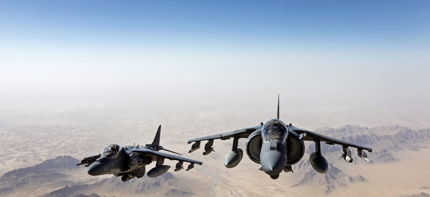 Two AV-8B Harrier jets with Marine Attack Squadron 311 fly over Helmand province, Afghanistan, on June 10, 2013