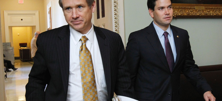 Sen. Mark Kirk, R-Ill., left, and Sen. Marco Rubio, R-Fla., leave a Republican caucus on Capitol Hill in Washington, Feb. 2, 2011.