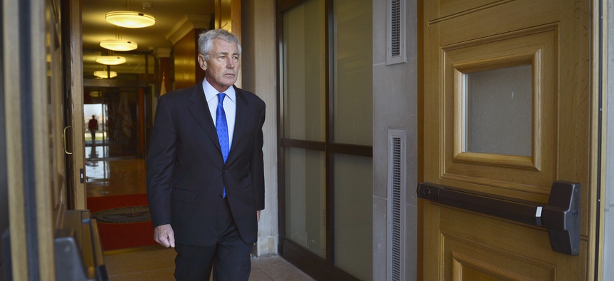 Secretary of Defense Chuck Hagel passes through the River Entrance doors of the Pentagon before a meeting with Qatar's Maj. Gen. Hamad bin Ali Al Attiyah, on November 21, 2014.