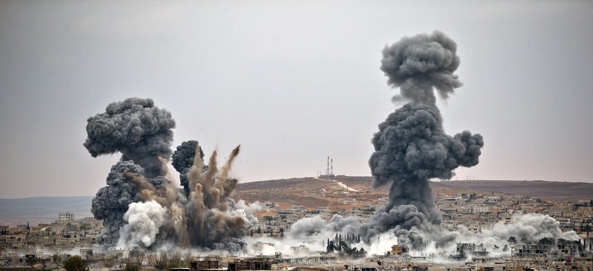 Smoke rises from the Syrian border town of Kobani, after air strikes were conducted by U.S. led coalition forces.