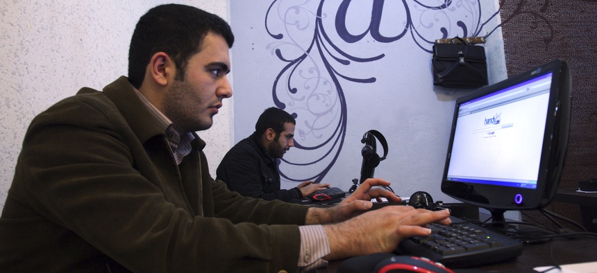 Iranian journalism students work at an internet cafe in central Tehran, Iran, Tuesday, Jan. 18, 2011.