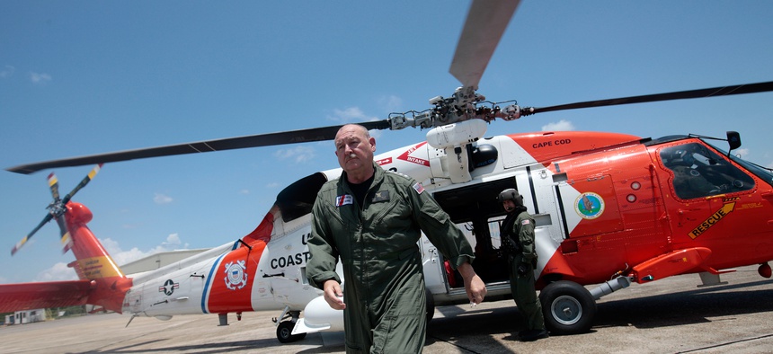 U.S. Coast Guard Adm. Thad Allen walks away from his helicopter in Mobile, Ala., following an air tour of Dauphin Island and the Alabama coast on Saturday, June 5, 2010.