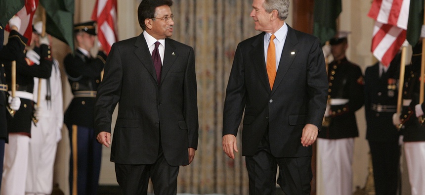President Bush walks with Pakistan's President Gen. Pervez Musharraf, on September 22, 2006.