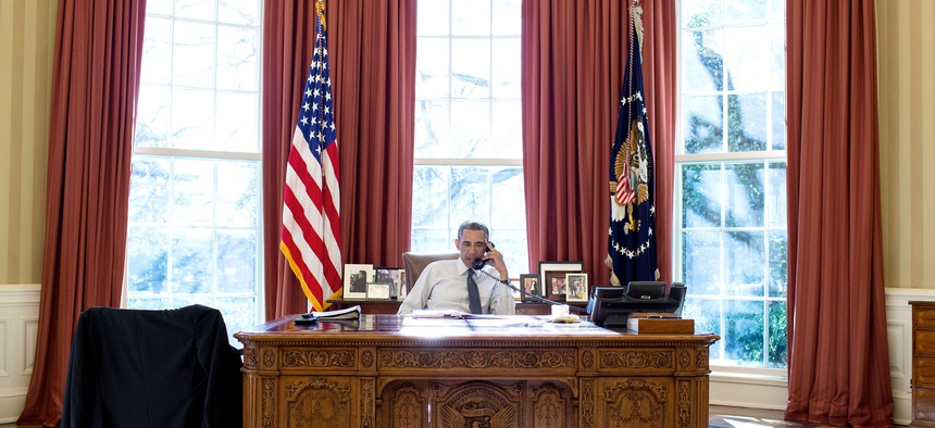 President Barack Obama talks on the phone with President Beji Caid Essebsi of Tunisia during a foreign leader call in the Oval Office, Jan. 5, 2015.
