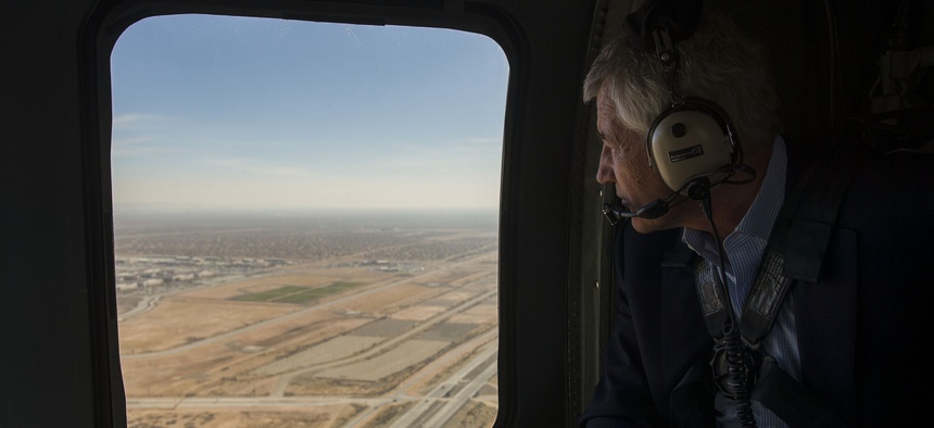 Defense Secretary Chuck Hagel looks out the window of an H-60 Blackhawk helicopter while flying from Fort Bliss, Tx., to Orogrande Range, N.M., on January 15, 2014.