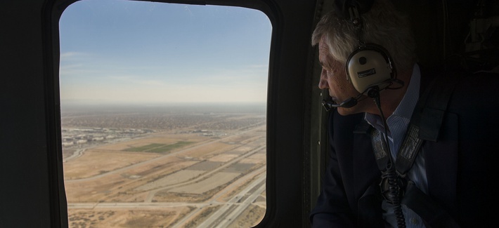 Defense Secretary Chuck Hagel looks out the window of an H-60 Blackhawk helicopter while flying from Fort Bliss, Tx., to Orogrande Range, N.M., on January 15, 2014.