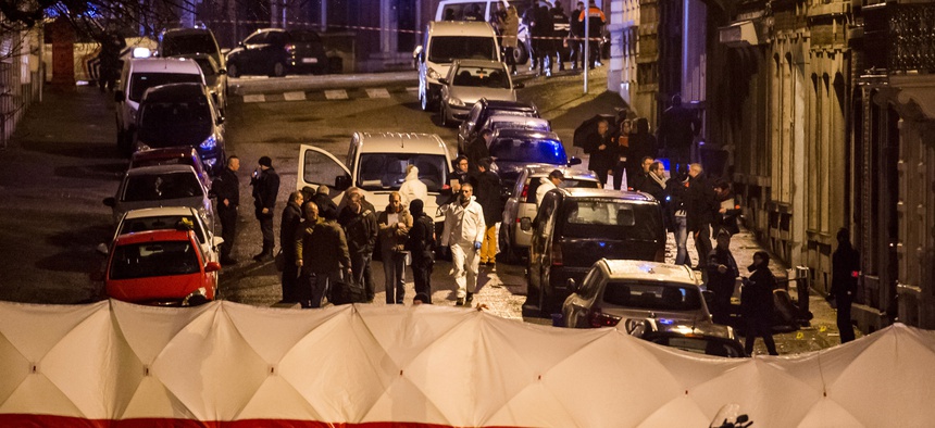 Police investigate a shootout in a street in Verviers, Belgium, on January 15, 2015.
